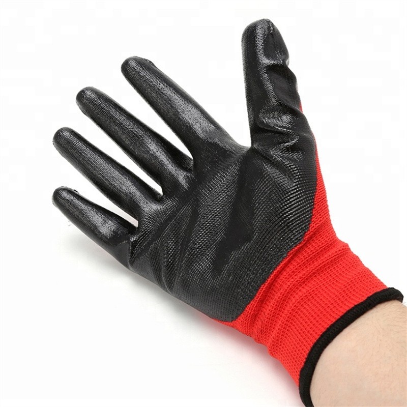 Červené polyesterové pletené čierne pracovné rukavice s hladkým nitrilom